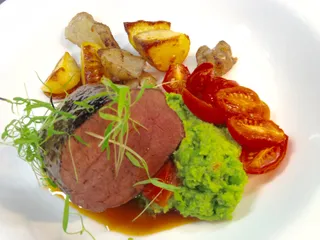 Lamb backstrap with pea puree