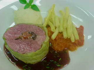 Lamb roulade with butter beans