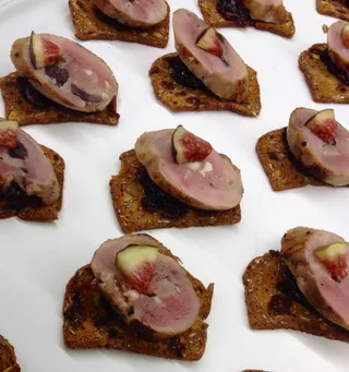 Quail figs and cranberries on crouton